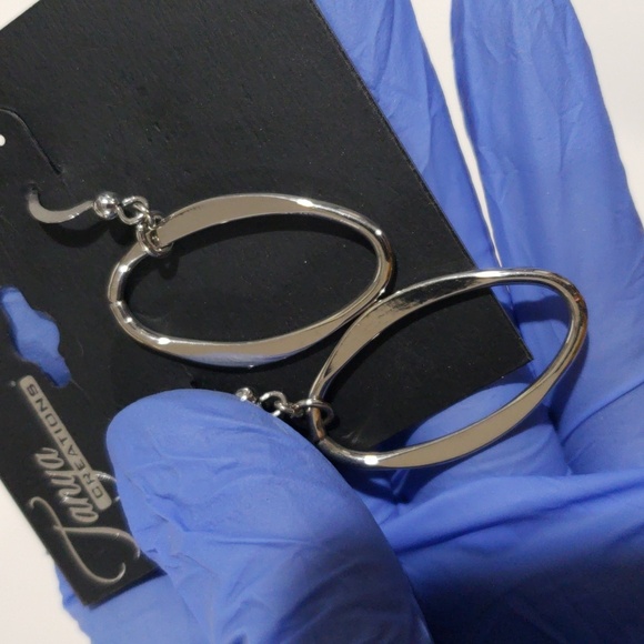 Elegant Silver tone Oval Hoop 2-inch Drop Earrings - Women's Fashion Jewelry - Picture 9 of 10